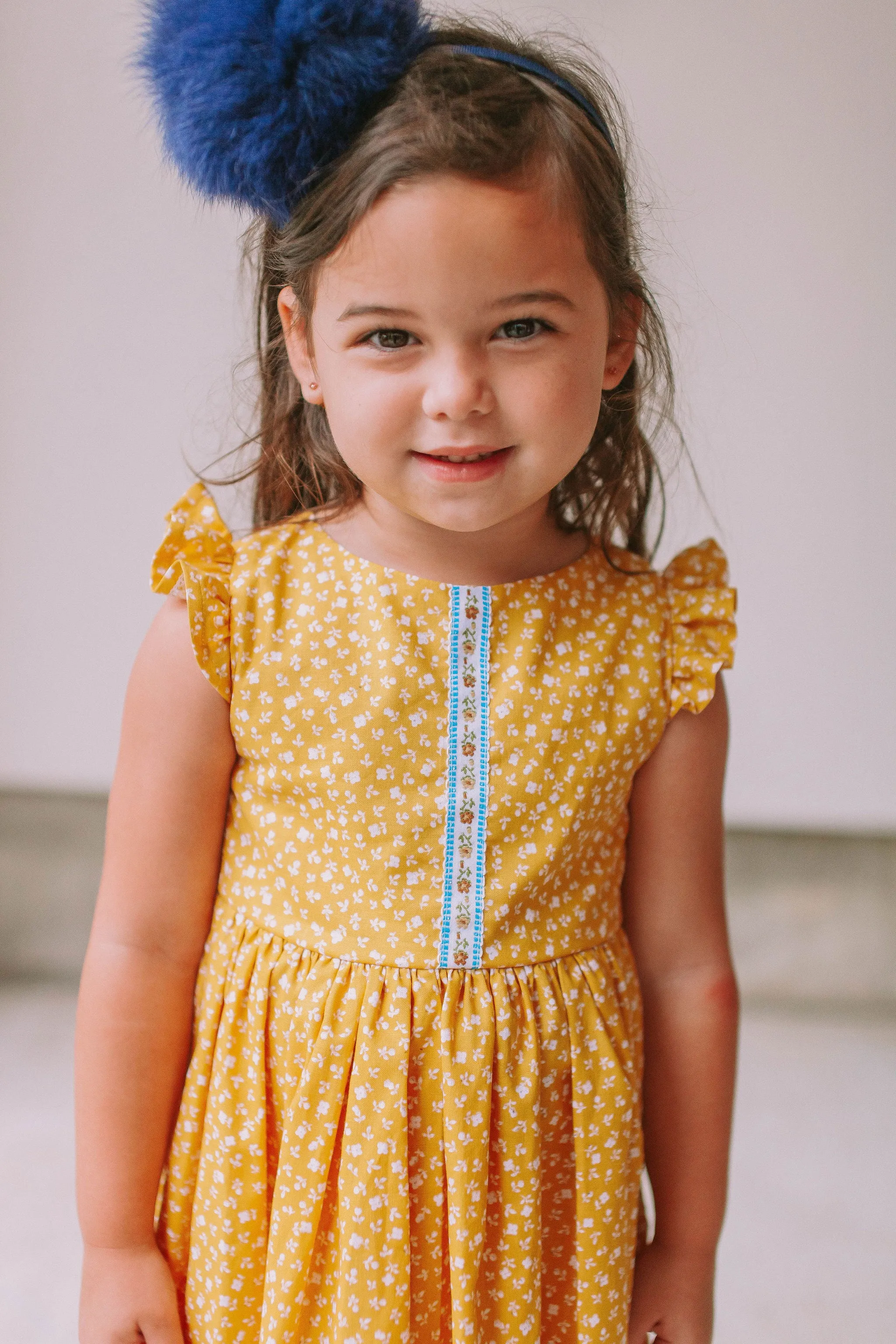 Little Girl's Yellow Ditsy Floral Twirl Dress with Blue Floral Trim